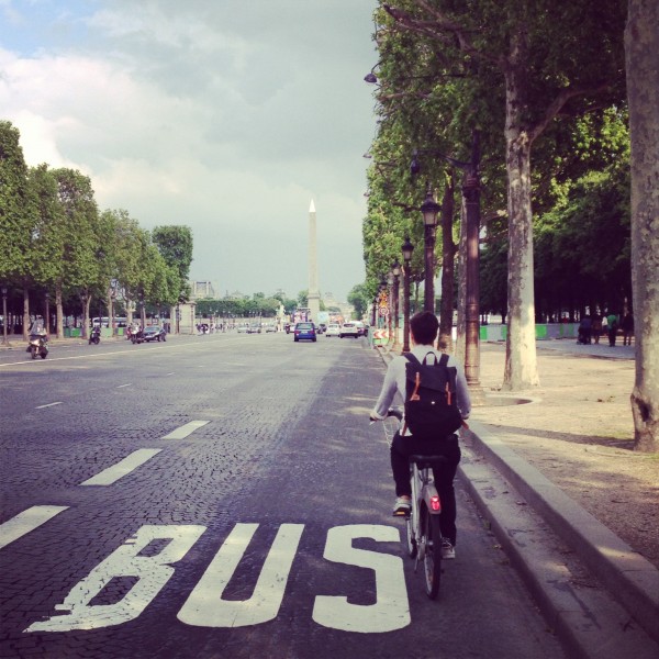 Cycling in traffic along the Champs-Élysées. photo by David Ross