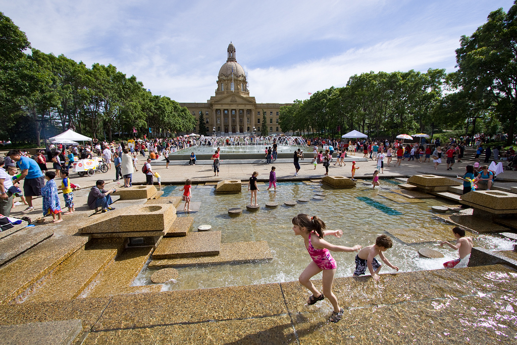 Families gather on a hot summer day at the Alberta Legislature Grounds, Edmonton. © Tom Young 2010