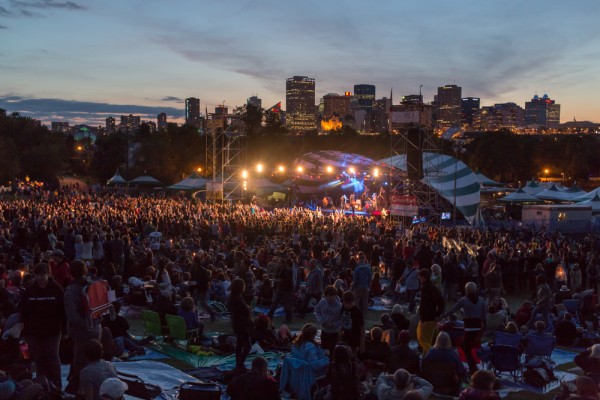 Main stage and downtown at dusk.