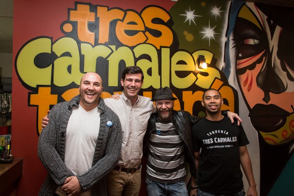 Posing for a photo with his friends at Tres Carnales Taqueria.