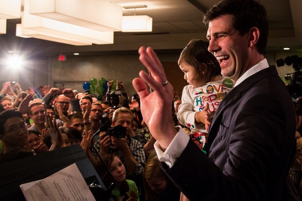 With daughter Alice in his arms, Don waves to supporters before giving his victory speech.