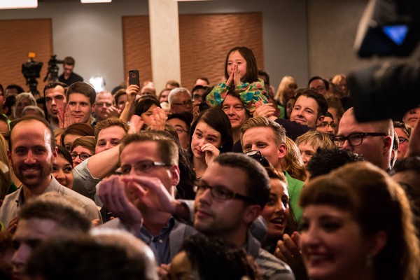 A supporter sheds a tear as others applaud during Don's election victory speech.