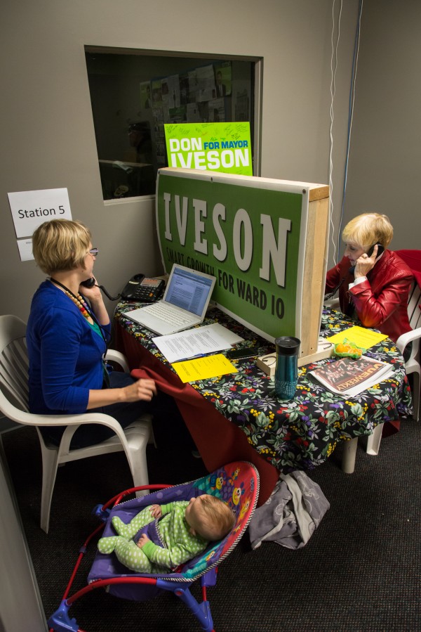 A sign from an earlier campaign partitions the space as volunteers of all ages work the phones at Iveson HQ.