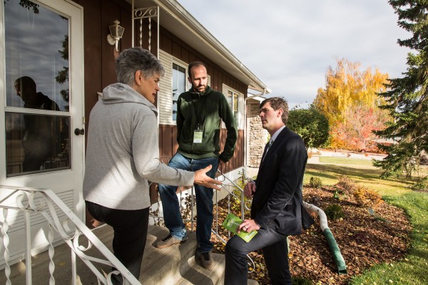 Intense conversation on the doorstep.