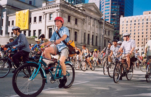 Bicyclists fill a street during a Critical Mass ride in Vancouver / Photo: David Pritchard via Flickr