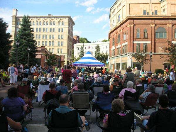 Open air concert in downtown Bangor, street closed off to traffic, pedestrians only.