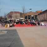 A simple and inexpensive concrete curb allows people to sit.