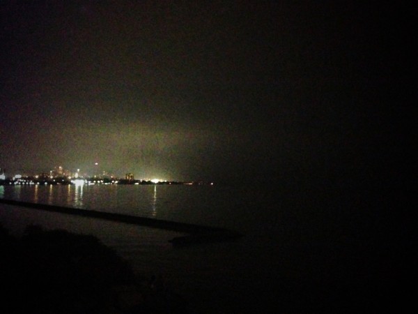 The glow of the CNE from the mouth of the Humber through the light rain and humidity