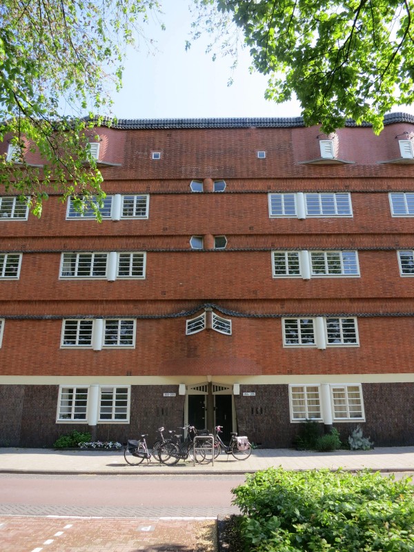 Mid-rise Art Deco apartment buildings line Amsterdam's outer streets