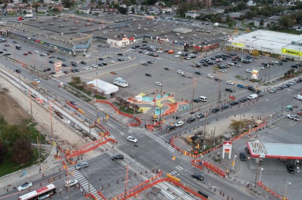 An eye-catching social hub in the community, the parking lot mural was designed to pay homage to the topography and contour lines of the Black Creek. (Image courtesy of Jane/Finch Centre)