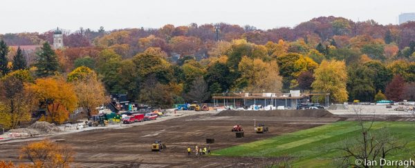 Workers lay new sod over the newly waterproofed roof of Rosehill Reservoir on Oct. 29 2020, while the new washroom is under construction on the eastern edge of the park.