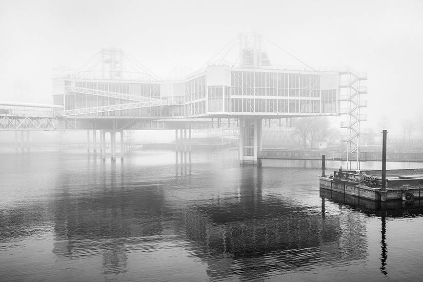 The Pods are steel and aluminum structures connected by bridges and suspended above the water. They originally housed a restaurant and exhibition spaces.