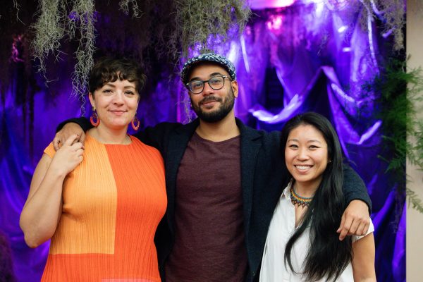 Method Collective members Fran Quintero Rawlings (left), Ziyan Hossain (centre), and Calla Lee (right) stand in front of the first nook within the Space for Grief installation. 