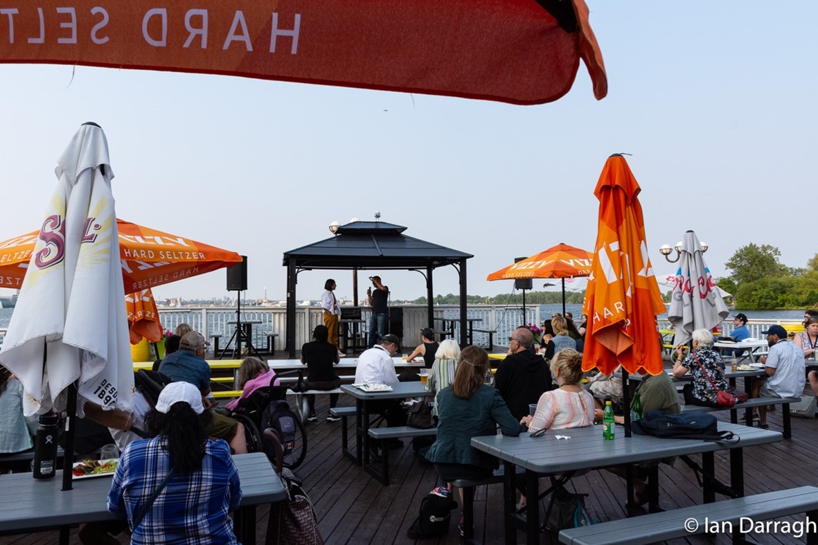 Community activists Zahra Ebrahim and Dave Meslin welcomed delegates on a patio on Toronto Island with a talk on how “Parks are where we rebuild democracy.”