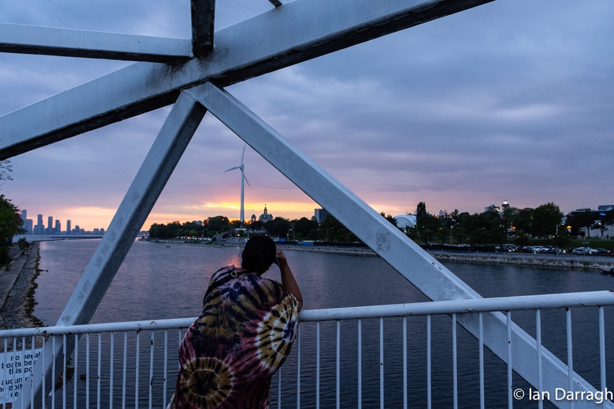 Visitor from Philadelphia photographs the sunset from the pedestrian bridge connecting Lake Shore Boulevard to Ontario Place’s West Island. More than a million folks found their way to Ontario Place last year to enjoy nature along the waterfront.