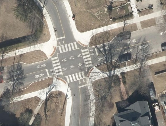 Overhead view of rebuilt intersection of High Park Blvd and Indian Rd (bump-outs, raised intersection). Image City of Toronto.