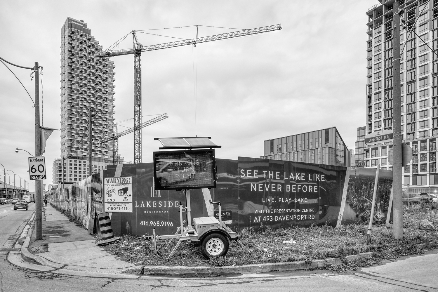 Hoardings for a new condo development in the East Bayfront district portray the virtues of life beside the lake.