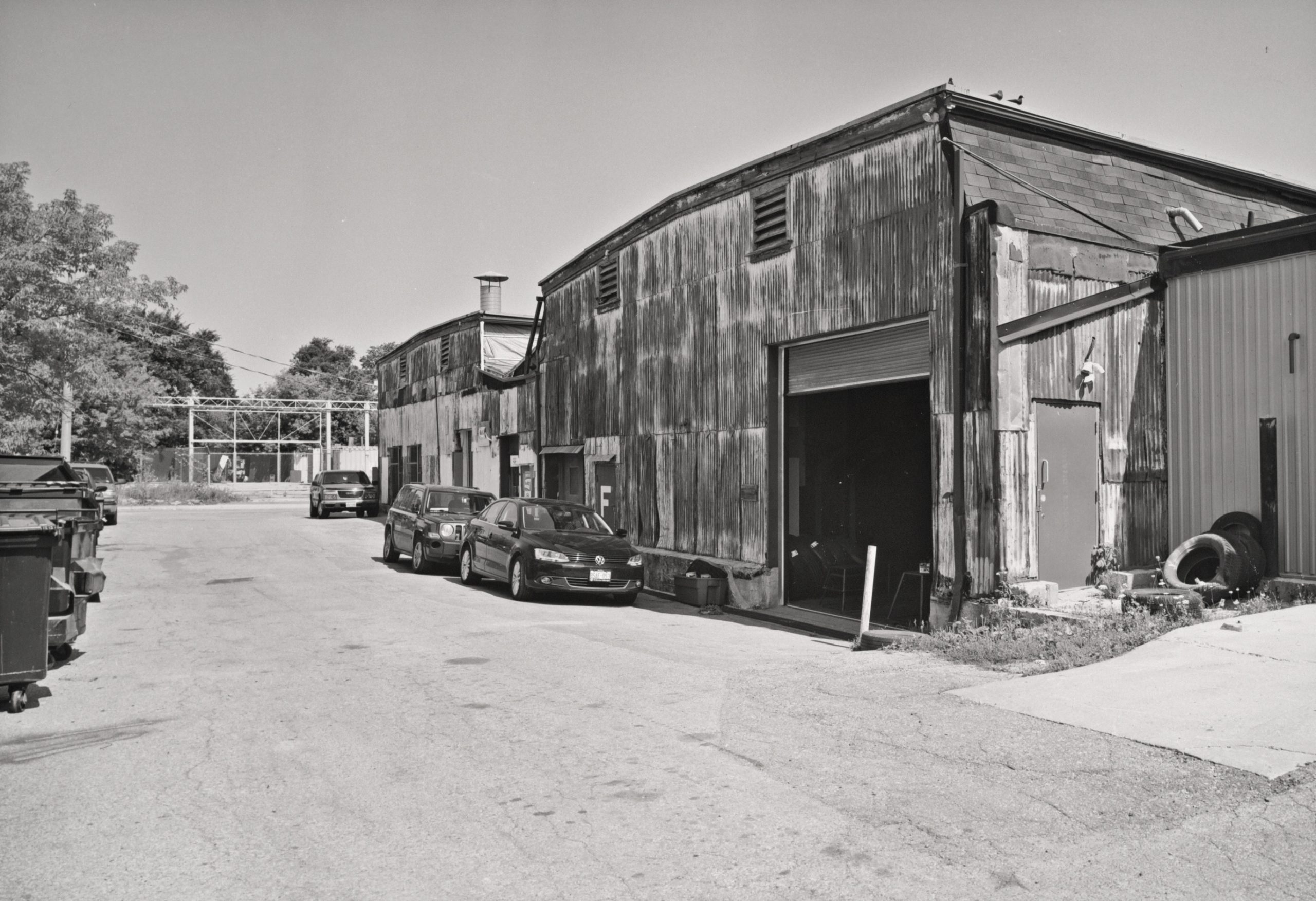 Rear view of twin sheds of 444 Dufferin, looking toward Alma Avenue, 2017