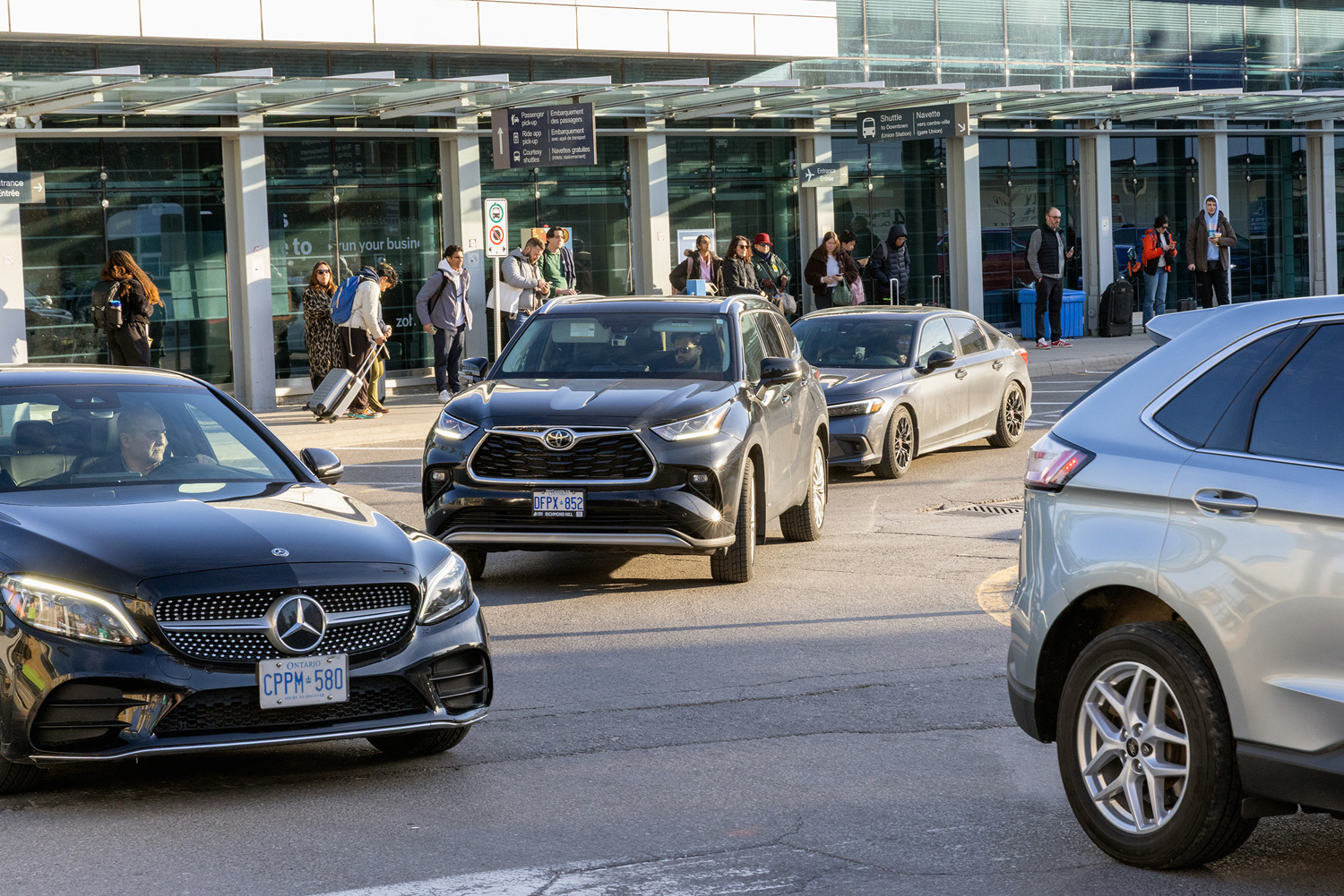 Cars line up at Billy Bishop Airport to pick up passengers. 
