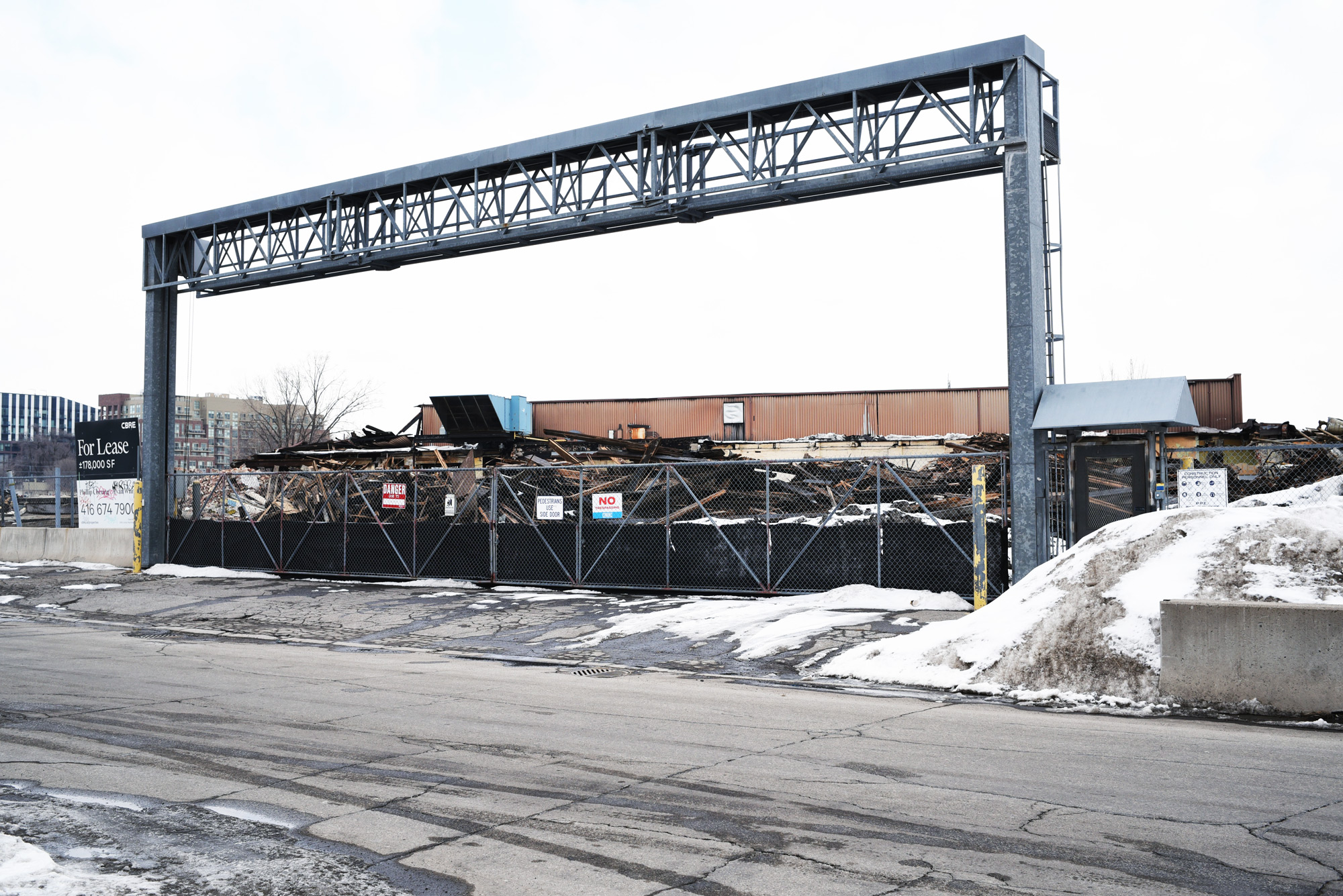 Main gate of abandoned National Rubber Technologies plant during demolition, February, 2026
