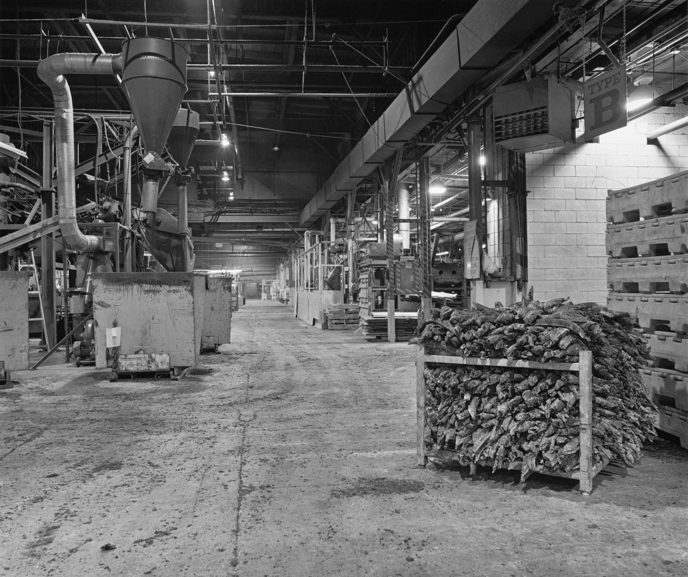 National Rubber Industries, view of production floor, Department 52, scrap rubber logs in foreground, January, 1993