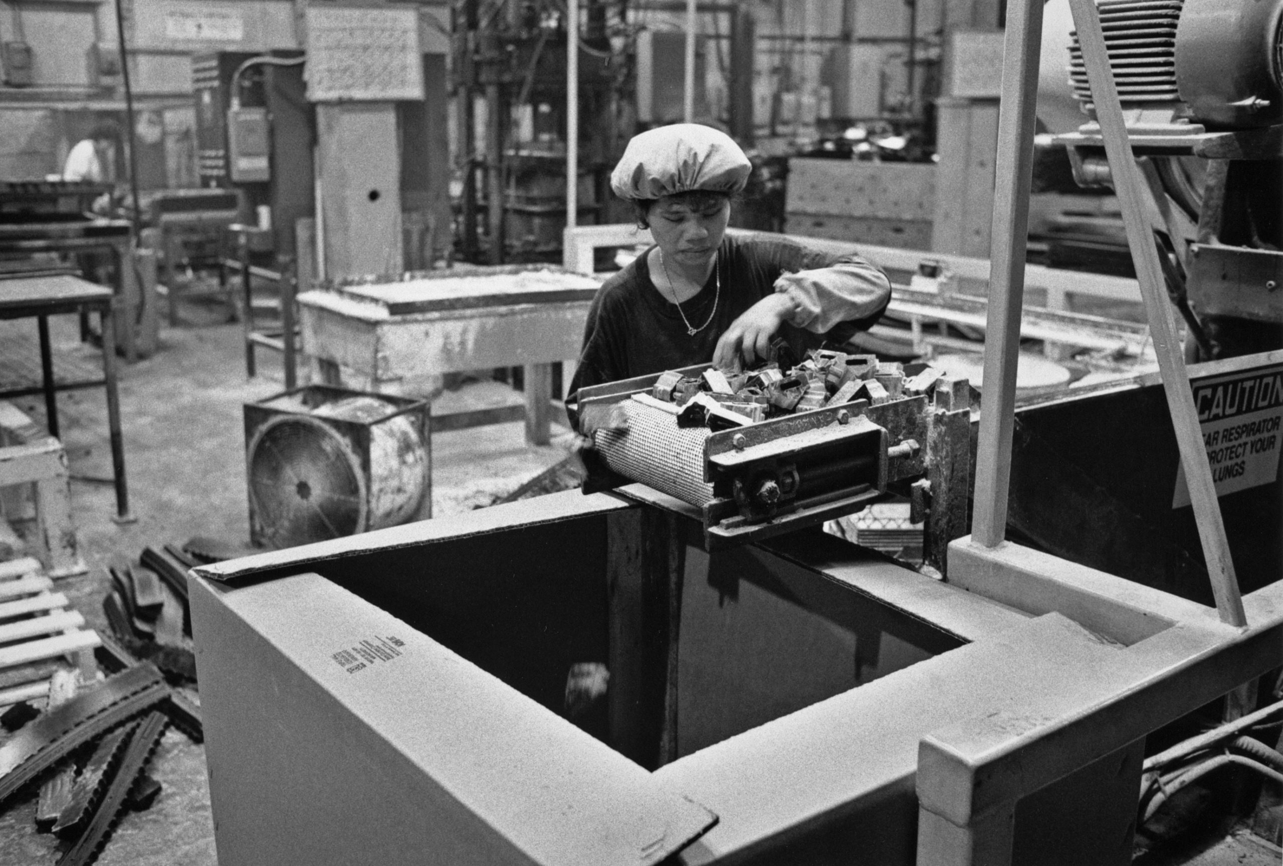 Ling Co inspecting small automotive parts, Department 54, May, 1993