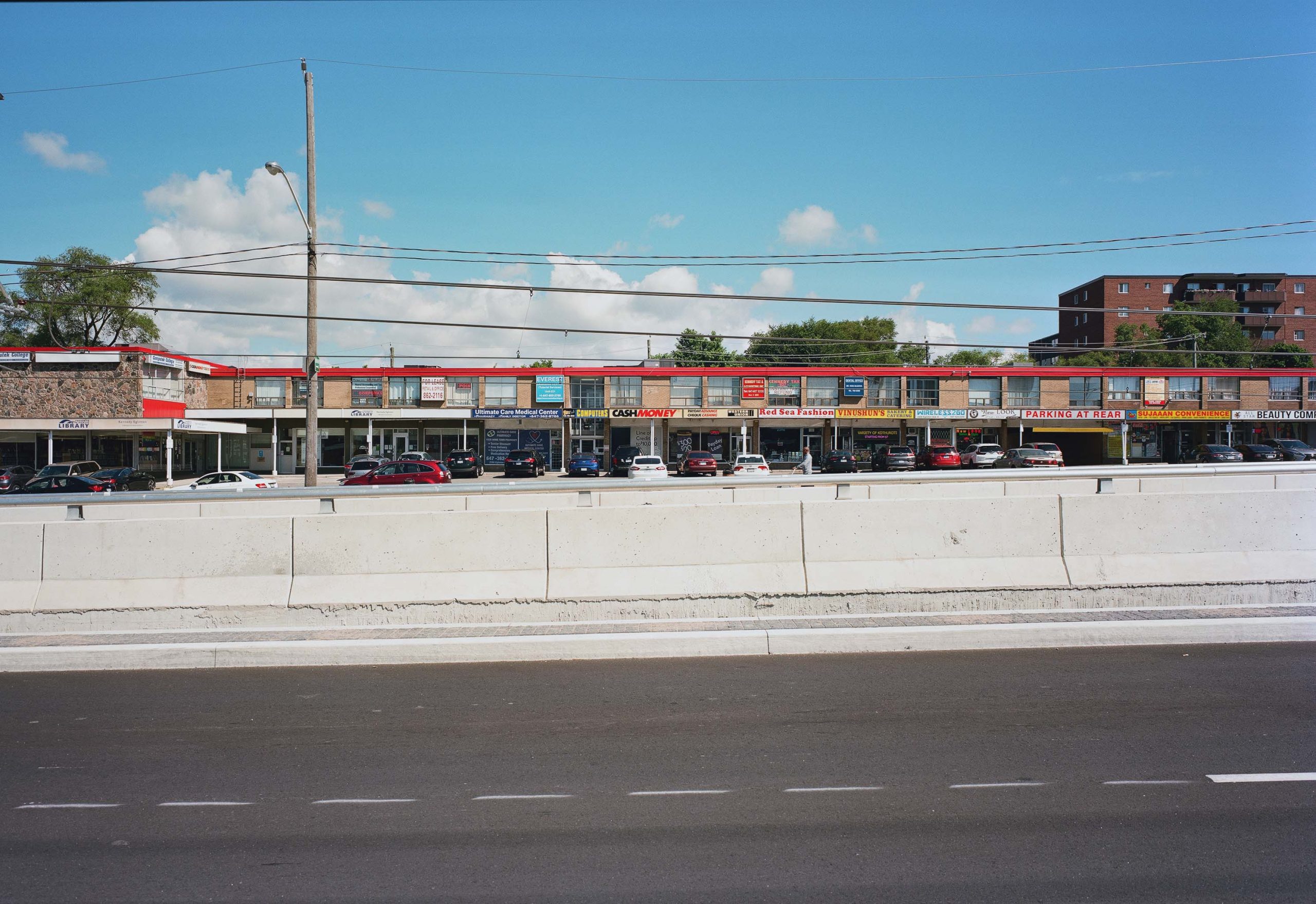 Looking north across Eglinton toward Liberty Plaza, 2022