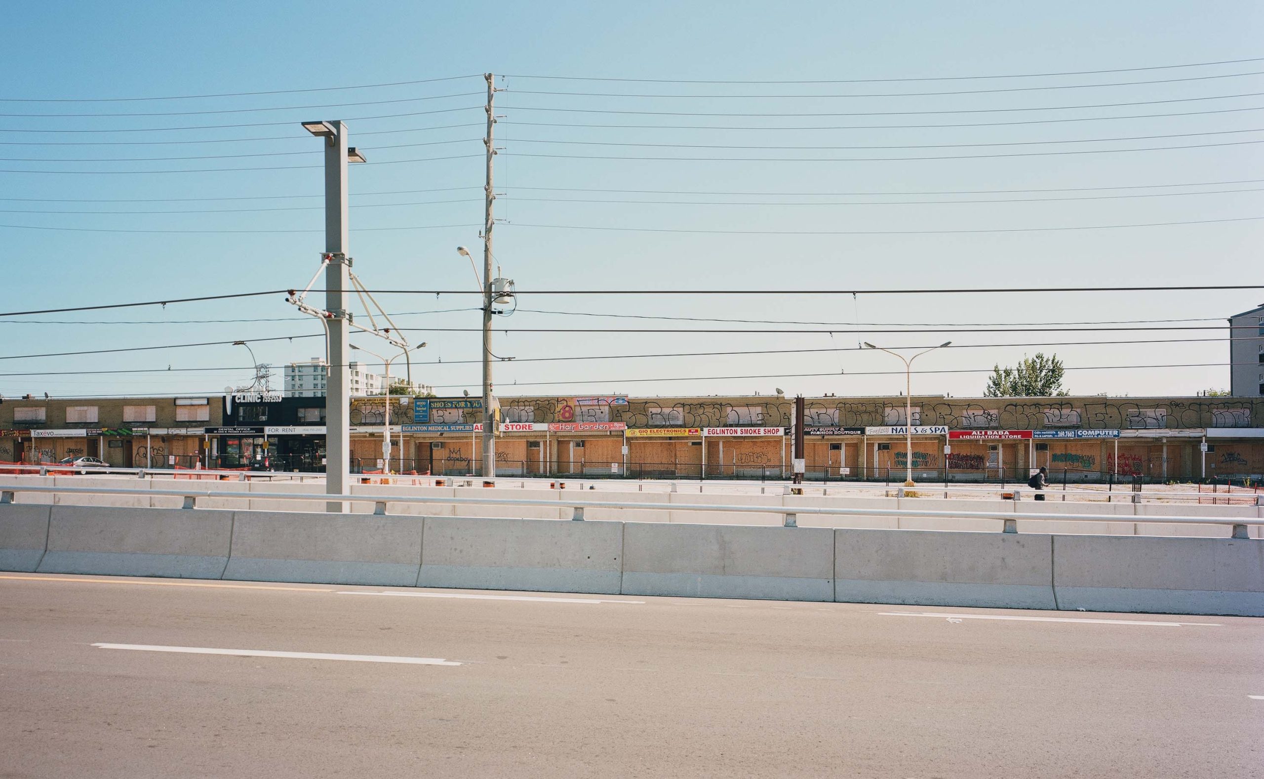 Looking south across Eglinton toward unnamed strip mall, 2022