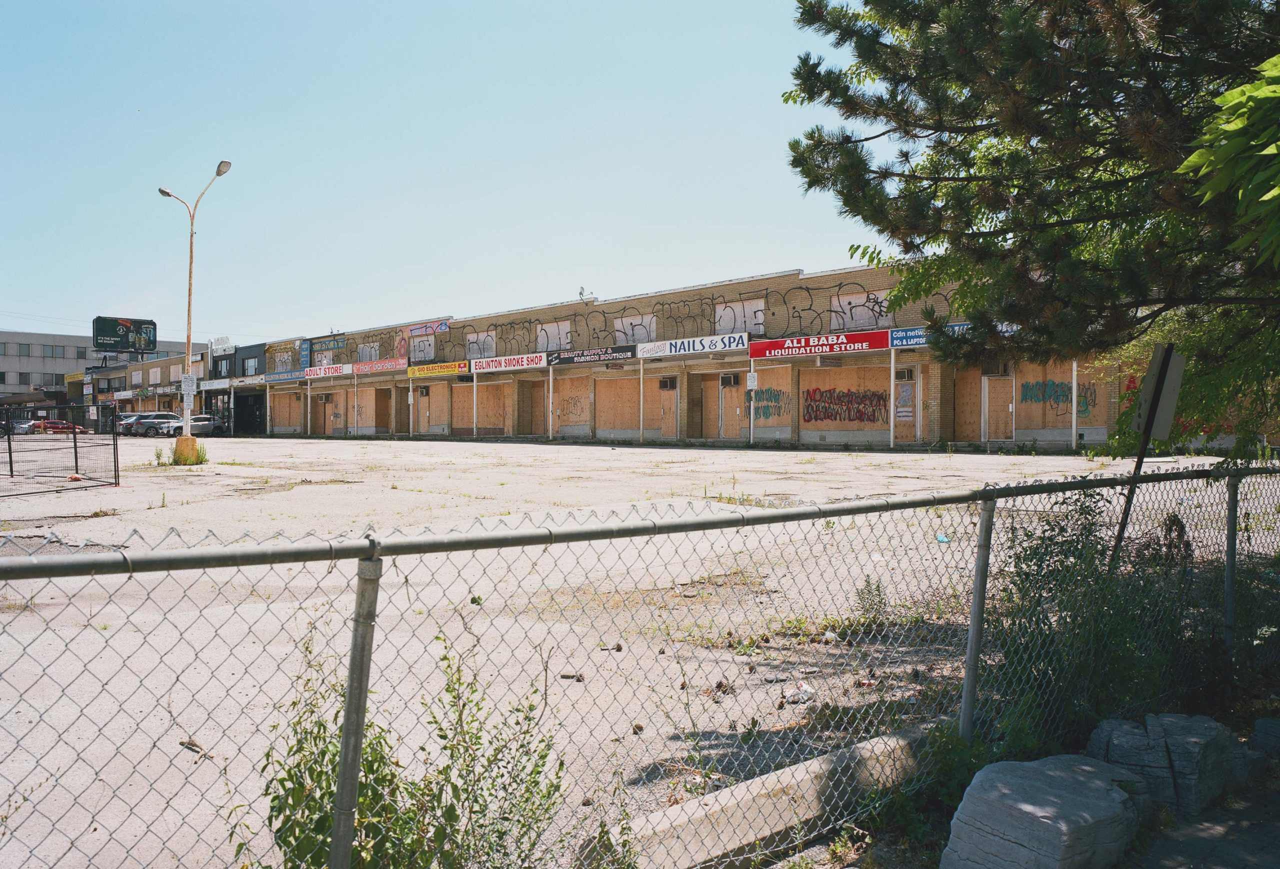 Abandoned section of strip mall, south side of Eglinton, 2022