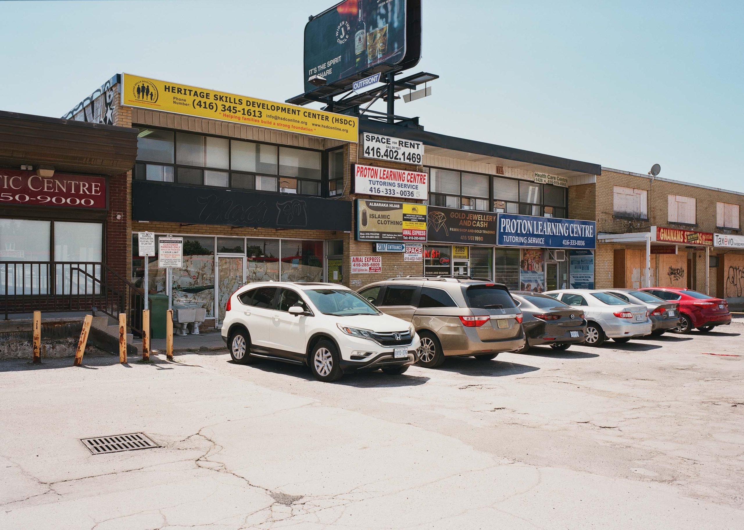 Occupied section of strip mall, south side of Eglinton, 2022