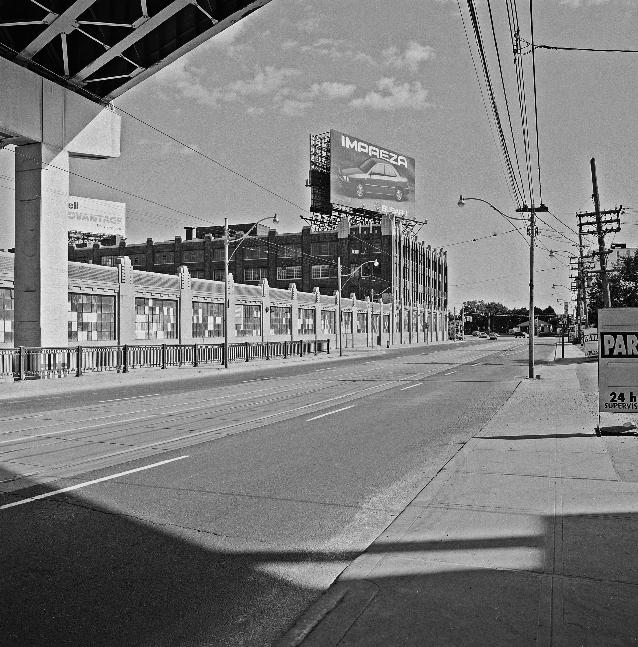 Bathurst Street, looking south toward former Loblaws Groceterias warehouse, September, 1984 Gift to Toronto Reference Library, 2021
