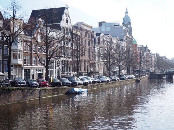 Cars parked along Amsterdam’s famous canals. 