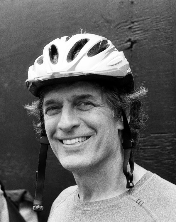 Portrait of Albert Koehl wearing cycling helmet