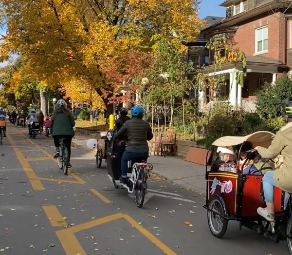 Adults and children on bikes