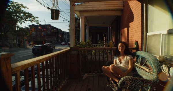 Woman sitting on her porch