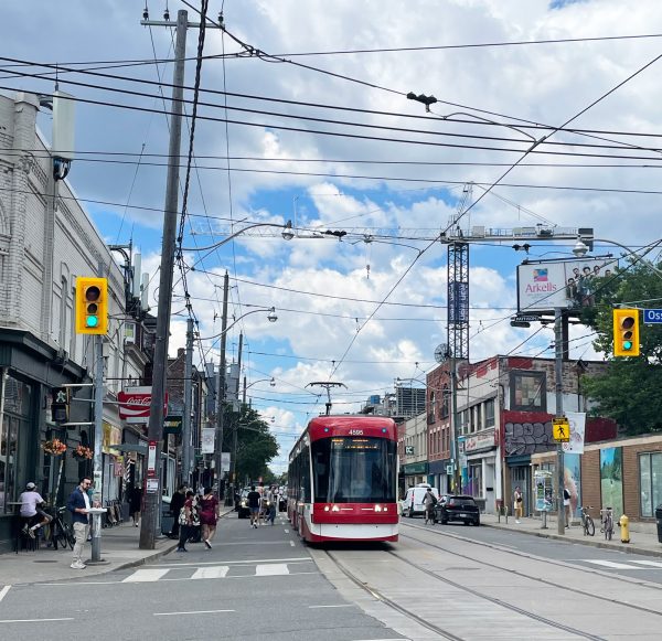 Streetcar on Toronto street, being boarded