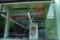 Hong Kong Cafe, with an ad for a film at the Golden Harvest Theatre at 319 Main, which showed chopsocky fare like Bruce Lee films. Photo by Paul Yee (1986), City of Vancouver AM1523-S6-F74-: 2008-010.0528.